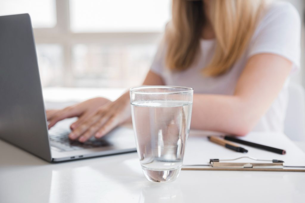 Drinking enough water throughout the day